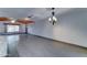 Open-concept living room featuring a chandelier and natural wood ceiling at 8220 E Montecito Ave, Scottsdale, AZ 85251