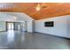 Spacious living room with wood-look tile flooring and a natural wood ceiling at 8220 E Montecito Ave, Scottsdale, AZ 85251