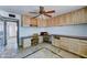 A room with tiled floor, built in shelves, and ceiling fan at 8220 E Montecito Ave, Scottsdale, AZ 85251