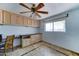 A room with natural light, tiled floor, built in shelves, and ceiling fan at 8220 E Montecito Ave, Scottsdale, AZ 85251