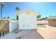 Detached shed in backyard, featuring brick trim and access from the paved patio at 8220 E Montecito Ave, Scottsdale, AZ 85251