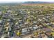 Residential neighborhood aerial shot showcases the community with tree lined streets and mountain views in distance at 8524 E Mariposa Dr, Scottsdale, AZ 85251