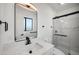 Modern bathroom with marble countertops, sleek fixtures, and a glass-enclosed shower at 8524 E Mariposa Dr, Scottsdale, AZ 85251