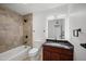 Stylish bathroom features a tiled shower and modern vanity, providing a spa-like experience within your home at 8524 E Mariposa Dr, Scottsdale, AZ 85251