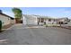 Single story home, with a garage, large driveway, and covered front patio at 8524 E Mariposa Dr, Scottsdale, AZ 85251