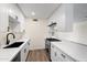 Modern kitchen with white cabinets, quartz countertops and stainless steel appliances at 8524 E Mariposa Dr, Scottsdale, AZ 85251