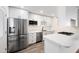Beautiful kitchen features stainless appliances, quartz countertops, and ample cabinet space at 8524 E Mariposa Dr, Scottsdale, AZ 85251