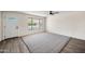 Inviting living room with stylish flooring, neutral walls, and a large window at 8524 E Mariposa Dr, Scottsdale, AZ 85251