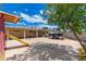 The backyard has a large concrete area and a tree at 8602 N 27Th Ave, Phoenix, AZ 85051