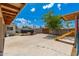 This backyard features a large concrete area and a yellow slide at 8602 N 27Th Ave, Phoenix, AZ 85051