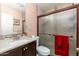 This full bathroom features a toilet, sink, and shower with a sliding glass door at 8602 N 27Th Ave, Phoenix, AZ 85051