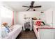 This bedroom features two twin beds and wood floors at 8602 N 27Th Ave, Phoenix, AZ 85051