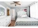 This bedroom features a ceiling fan and tile floors at 8602 N 27Th Ave, Phoenix, AZ 85051