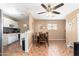 This dining room is connected to the kitchen and living room and has a ceiling fan at 8602 N 27Th Ave, Phoenix, AZ 85051