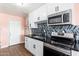 Bright kitchen featuring stainless steel appliances, stylish backsplash, and ample cabinet space at 8602 N 27Th Ave, Phoenix, AZ 85051