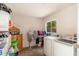 Functional laundry room with washer, dryer, window, and storage at 8602 N 27Th Ave, Phoenix, AZ 85051