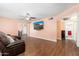 Inviting living room featuring wood floors and view to adjacent dining room at 8602 N 27Th Ave, Phoenix, AZ 85051