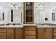 Bathroom with dual sinks, mirrored cabinets, and ample counter space, offering functionality at 8840 E Sunland Ave # 137, Mesa, AZ 85208