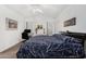 Bright bedroom with vaulted ceiling, large bed, office setup, and ample natural light at 8840 E Sunland Ave # 137, Mesa, AZ 85208