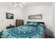 Bedroom featuring natural light, a decorative bedspread, and a neutral-toned dresser at 8840 E Sunland Ave # 137, Mesa, AZ 85208