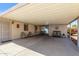 Spacious covered carport area with ample seating and access to the home's entrance at 8840 E Sunland Ave # 137, Mesa, AZ 85208
