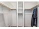 Walk-in closet with rods, shelving, and ample storage space for organization and convenience at 8840 E Sunland Ave # 137, Mesa, AZ 85208