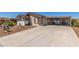 Inviting single-story home with extended driveway and covered carport area for outdoor seating at 8840 E Sunland Ave # 137, Mesa, AZ 85208