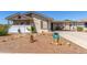 Charming single-story home featuring decorative rock landscaping and a covered carport at 8840 E Sunland Ave # 137, Mesa, AZ 85208