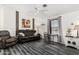 Comfortable living room with stylish flooring, a ceiling fan, and abundant natural light at 8840 E Sunland Ave # 137, Mesa, AZ 85208