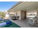 Covered patio perfect for outdoor dining and entertaining, with shade and comfortable seating at 8840 E Sunland Ave # 137, Mesa, AZ 85208
