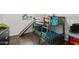 This ' bedroom features a bunk bed with a slide and wood-look floors at 9147 W Minnezona Ave, Phoenix, AZ 85037