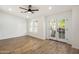 Bright bedroom with hardwood floors, ceiling fan and a private balcony overlooking the neighborhood at 942 S Ash Ave # 104, Tempe, AZ 85281