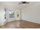 Bright bedroom featuring sleek ceiling fan, light wood floors and large bay window for lots of natural light at 942 S Ash Ave # 104, Tempe, AZ 85281