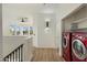 Upstairs laundry area features washer and dryer, with easy access to living spaces at 942 S Ash Ave # 104, Tempe, AZ 85281