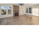 Bright open concept living room with modern fireplace, hardwood floors, and ample natural light at 942 S Ash Ave # 104, Tempe, AZ 85281