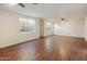 Spacious living room featuring dark wood floors, neutral paint and a ceiling fan to keep cool at 942 S Ash Ave # 104, Tempe, AZ 85281