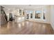 Spacious open-concept living room with hardwood floors, white cabinetry, and lots of light at 942 S Ash Ave # 104, Tempe, AZ 85281