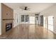 Open living room featuring hardwood floors, modern fireplace, and plenty of natural light at 942 S Ash Ave # 104, Tempe, AZ 85281