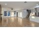 Bright, expansive living area featuring hardwood floors, modern fireplace, and stairs to second level at 942 S Ash Ave # 104, Tempe, AZ 85281