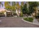 A lovely community street view showcases well-maintained townhomes, mature trees, and charming landscaping at 942 S Ash Ave # 104, Tempe, AZ 85281