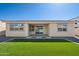 Backyard with patio area and artificial grass lawn at 9510 E Theia Dr, Mesa, AZ 85212