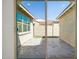 The backyard has a patio area between 2 sides of the house at 9510 E Theia Dr, Mesa, AZ 85212