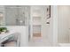 Bright bathroom features a glass shower, large mirror, and a walk-in closet at 9510 E Theia Dr, Mesa, AZ 85212