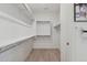 This walk-in closet features built-in shelving and ample space for storage at 9510 E Theia Dr, Mesa, AZ 85212