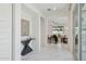 Bright hallway with marble floors leads to an open living area, seamlessly blending style and functionality at 9510 E Theia Dr, Mesa, AZ 85212