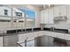 Well-lit kitchen showcases stainless appliances, modern cabinetry, and black granite countertops at 9510 E Theia Dr, Mesa, AZ 85212