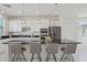 Beautiful kitchen with a spacious island, modern lighting, and stainless steel appliances at 9510 E Theia Dr, Mesa, AZ 85212