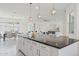 Open-concept kitchen flows into the dining and living areas, great for entertaining at 9510 E Theia Dr, Mesa, AZ 85212