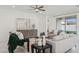 Bright living room featuring modern sofas, stylish decor, and an open layout for seamless entertaining and relaxation at 9510 E Theia Dr, Mesa, AZ 85212