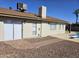 A private backyard featuring a sliding glass door, a pool, a desert-scape and beautiful pavers at 9612 N 52Nd Dr, Glendale, AZ 85302
